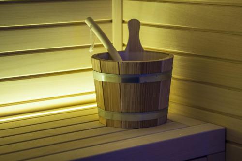 a wooden container with a toothbrush in it at Cataleya Resort & Spa in Notaresco