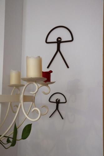 a wall with four at Hostal Arco Plaza in Mojácar