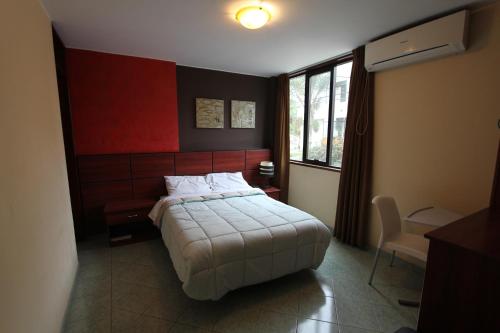 Postel nebo postele na pokoji v ubytování Hotel Chicama