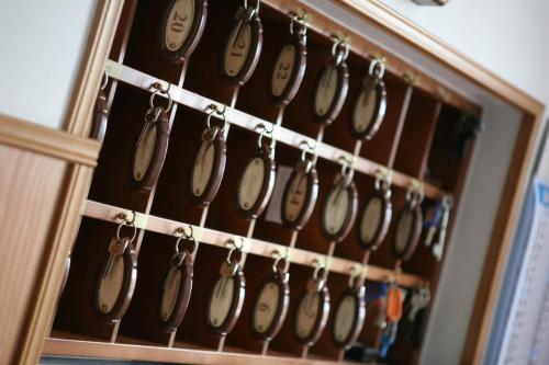 a bunch of clocks hanging on a rack at Hotel Dorico in Ancona