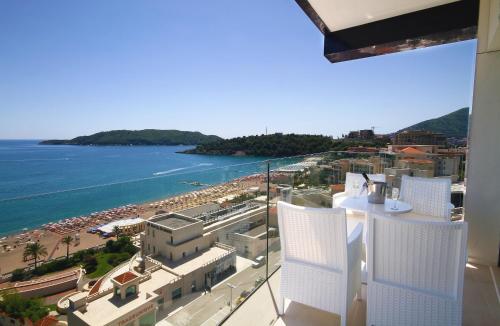a view of a beach and the ocean from a building at Shine residence in Budva