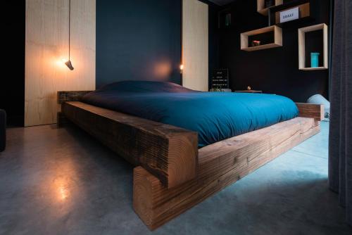 En eller flere senge i et værelse på Boutique B&B Graaf