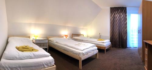 Кровать или кровати в номере SeSil Apartman