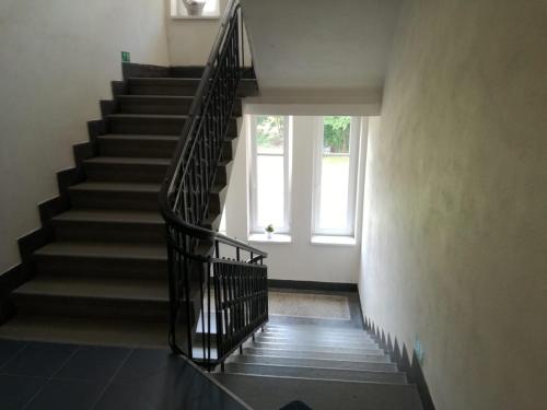 a staircase in a building with a window at Apartmán u Horynů - Sadová in Česká Třebová