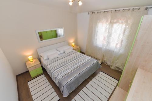 A bed or beds in a room at Apartment Roko