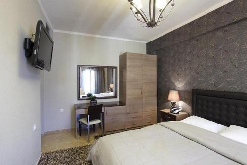 מיטה או מיטות בחדר ב-Delfini Hotel