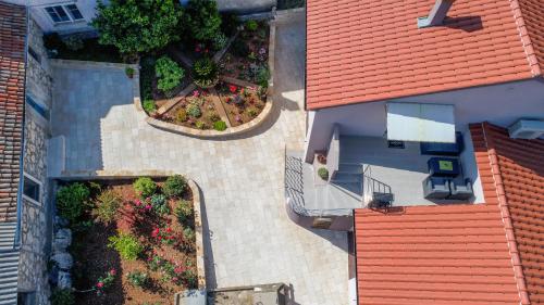 an overhead view of a house with a garden at Apartment Roko in Ugljan