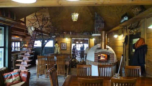 a restaurant with a wood fired oven in a room at Bučický mlýn in Rožďalovice
