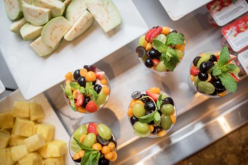 a bunch of fruit in muffins in a display case at Peace Lodge in Vara Blanca