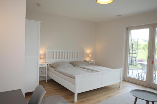 Ένα ή περισσότερα κρεβάτια σε δωμάτιο στο Appartements Rodenstein