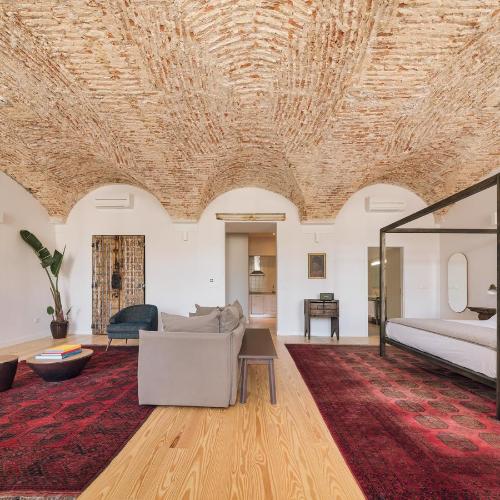 a living room with a couch and a table at The Visionaire Apartments in Lisbon