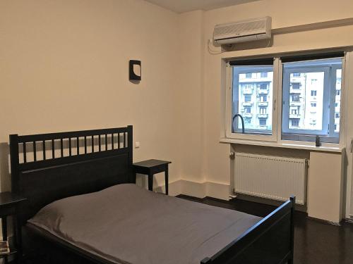 מיטה או מיטות בחדר ב-Conta Apartment