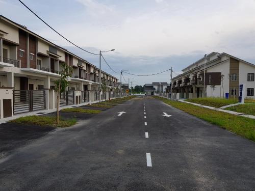 an empty street next to some apartment buildings at MY Homestay KLIA in Sepang