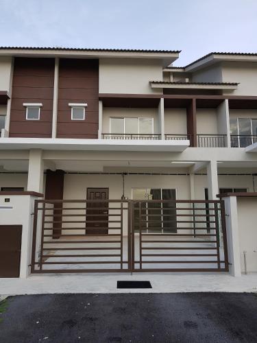 a house with a gate in front of it at MY Homestay KLIA in Sepang