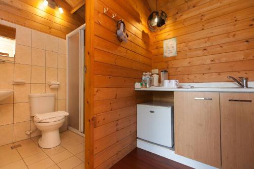 a bathroom with a toilet and a sink at Locasu in Datong