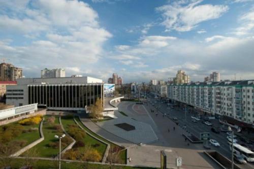 a view of a city with buildings and a street at 7 Sky on Yevhena Konovaltsia in Kyiv