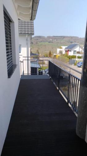 a balcony of a house with a view of a street at FeWo - bei Tati 95qm in Singen