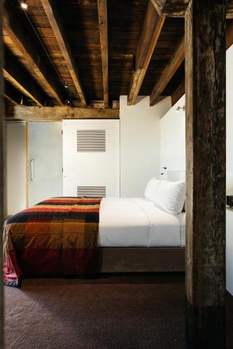 a bedroom with a large bed in a room at The Henry Jones Art Hotel in Hobart