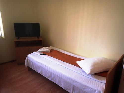 Un pat sau paturi într-o cameră la Vila Zuela