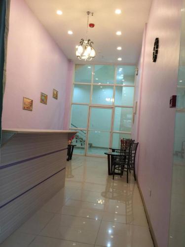 a room with a bar with chairs and a table at Meaco Royal Hotel - Lipa in Lipa