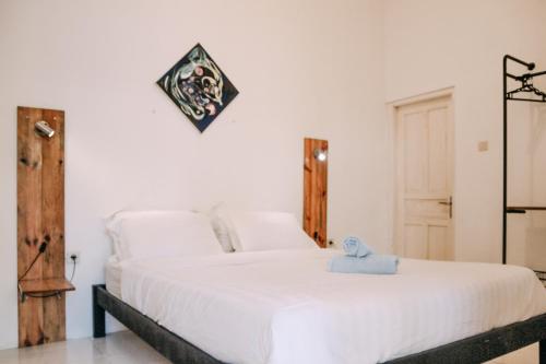 Tempat tidur dalam kamar di Pojok Pas