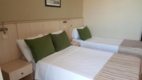 Ένα ή περισσότερα κρεβάτια σε δωμάτιο στο İleri Hotel & Apartments