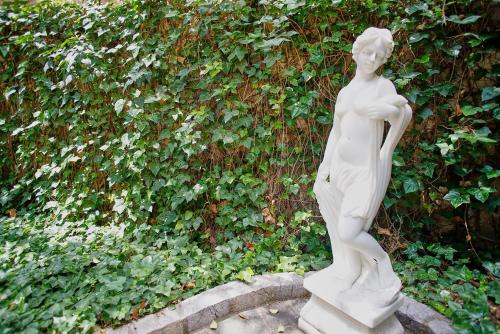 a statue of a woman standing on a step at Casa Delmonte - Turismo de Interior in Palma de Mallorca