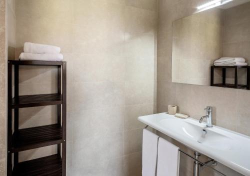 a bathroom with a sink and a mirror at Tenuta Lamborghini Golf & Resort in Panicale