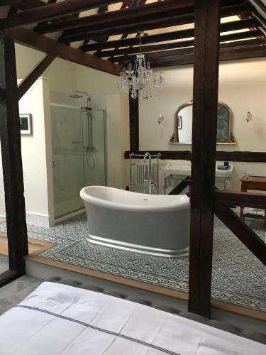 a large bathroom with a tub and a shower at Number 5 in Rye