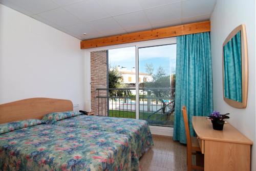 Postel nebo postele na pokoji v ubytování Hotel Port-Bo