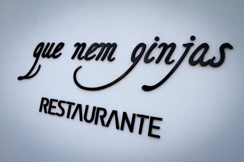a sign with the words call new guernica retirement at Hotel Vila D'Óbidos in Óbidos