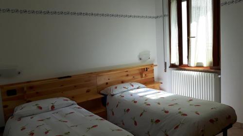 Postel nebo postele na pokoji v ubytování Trattoria Bar Pace