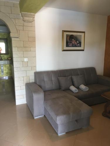 a living room with a couch and a table at Apartments Barbara in Poreč