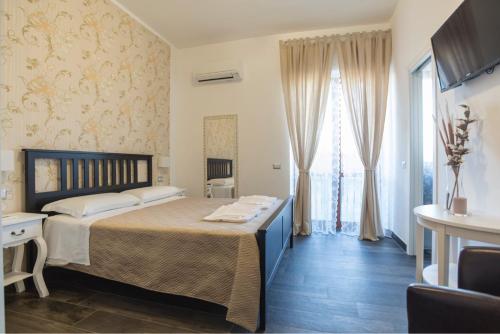 Postel nebo postele na pokoji v ubytování B&B Civico 41 Salerno