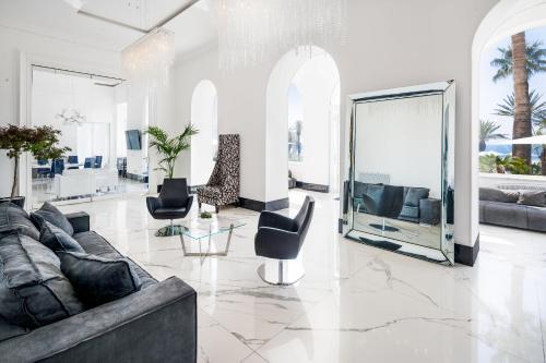 a large living room with a couch and chairs at Miramare The Palace Resort in Sanremo