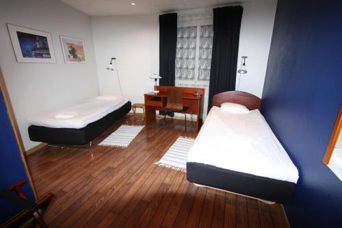 Postel nebo postele na pokoji v ubytování Hotell Linnéa