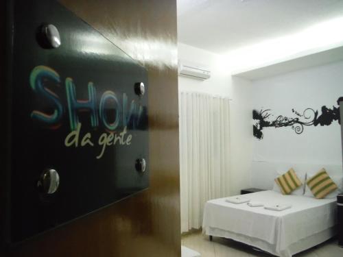 Ein Bett oder Betten in einem Zimmer der Unterkunft Hotel Basilio Mongaguá