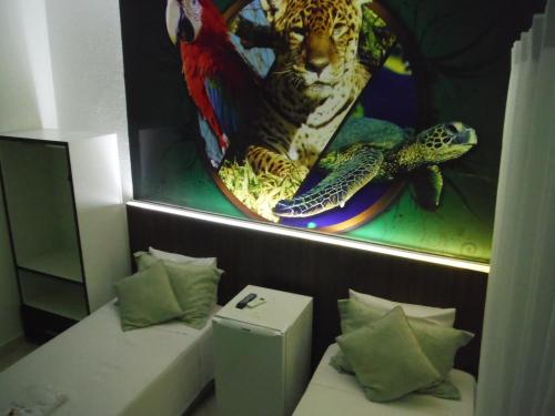 Ein Bett oder Betten in einem Zimmer der Unterkunft Hotel Basilio Mongaguá