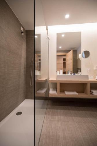 a bathroom with a shower and a sink at Hotel La Baita in Folgaria