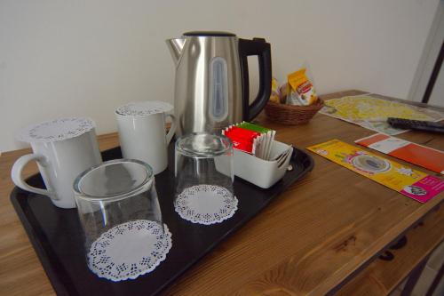 a black tray with a blender and cups on a table at Il Rifugio Dei Templari in Lecce