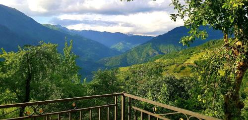 a view of a valley with mountains in the background at Luka House in Akhaldaba