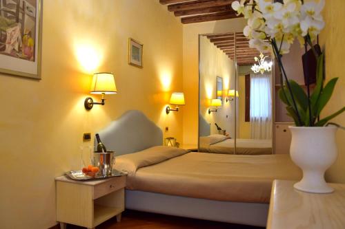 מיטה או מיטות בחדר ב-Residenza Favaro