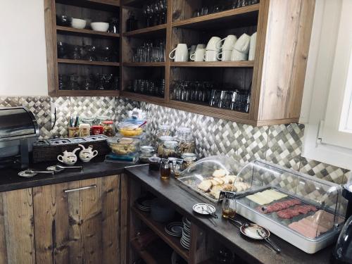 a kitchen with a counter with food on it at Villa Livadaros in Karterados