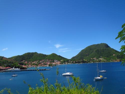 a view of a bay with boats in the water at Residence Hôteliere Hurlevent in Grande Anse