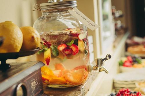 a jar filled with fruit on top of a counter at Locanda I Girasoli in Misano Adriatico