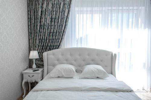 Кровать или кровати в номере Apartment Status