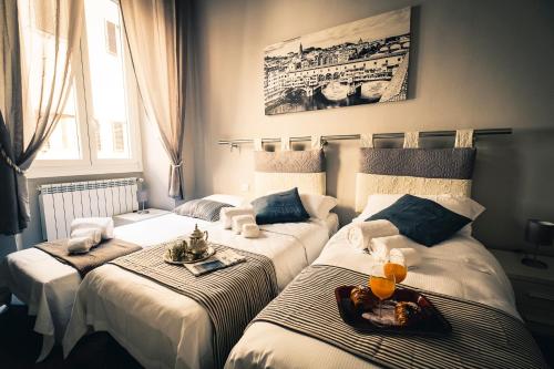 מיטה או מיטות בחדר ב-Silver Novella Luxury Apartment - Centro Storico