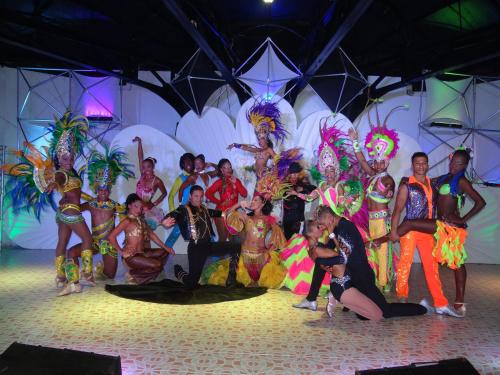 a group of people in costumes on a stage at Hotel Arena Blanca by Dorado in San Andrés