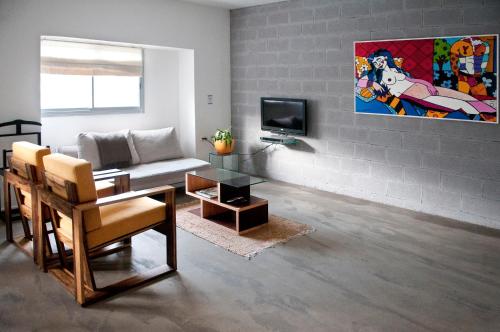 a living room with a couch and a table at G38 Rental Apartment Building in Haifa
