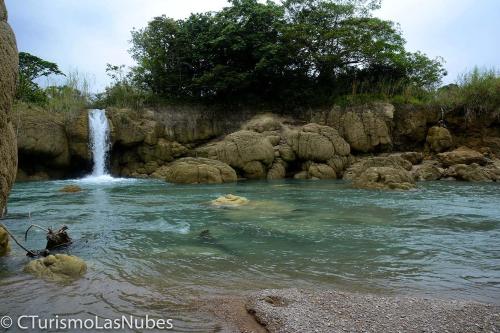 a waterfall in front of a river with rocks at Ecolodge Las Nubes Chiapas in La Fortuna Gallo Giro